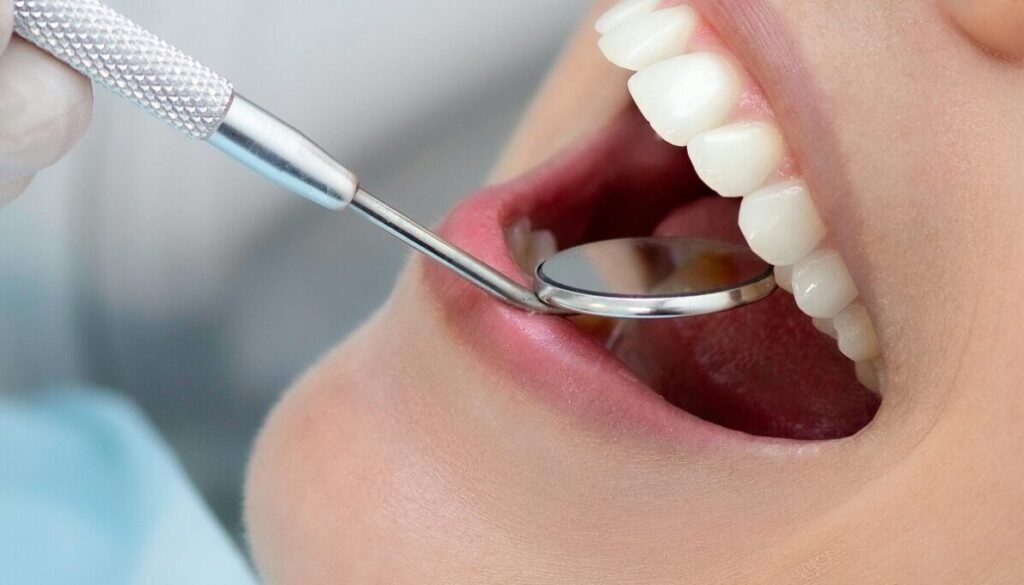 A dentist evaluating sensitivity typically checks for visible enamel wear, gum recession, exposed root surfaces, and signs of grinding such as flattened cusps.